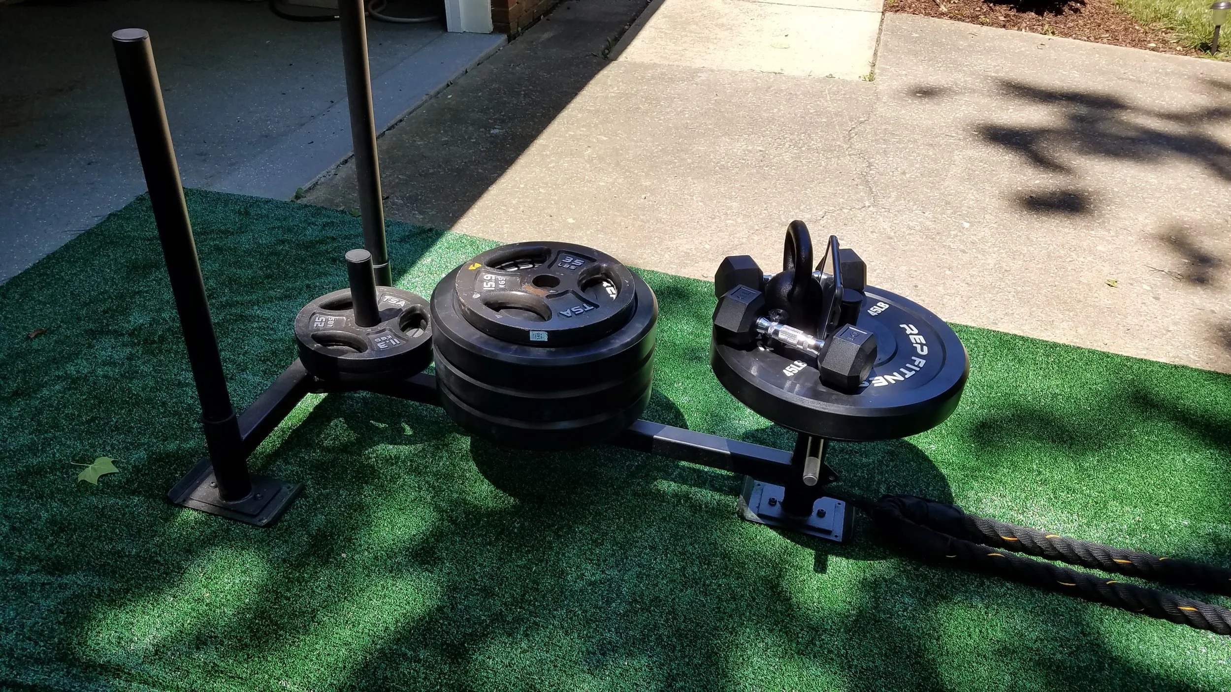 Today what we have is a sled from the folks at Titan Sports, an iPad mini from the Apple gurus, and 330lbs of pure delight from Rep Fitness. Total weight today is 400lbs. PLEASE NOTE the highly technical approach to securing my iPad of wedging it between a pair of dumbbells, a kettlebell and the sled (can you say MacGuyver?)
