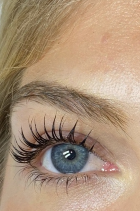 A close-up of a lady with lash lift (perm) results.