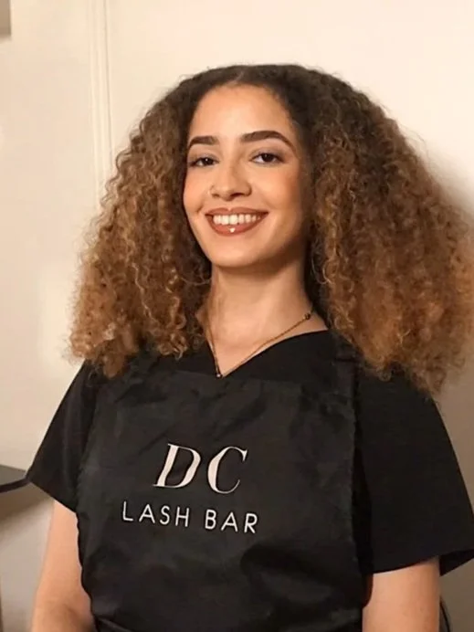 A senior technician specializing in eyelash extensions and threading at DC Lash Bar.