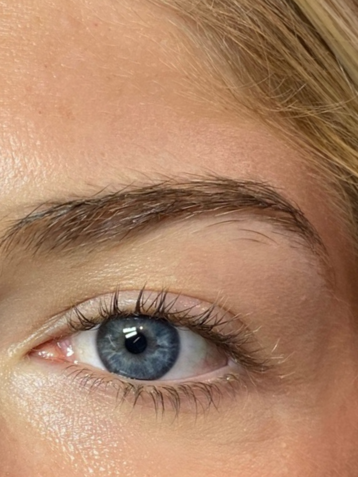 Close-up of a woman's eyes with lash lift (perm) results.