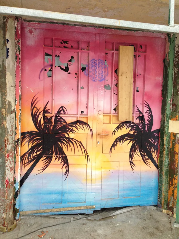 Crazy tropical double doors. Gateway to underground tiki themed disco?