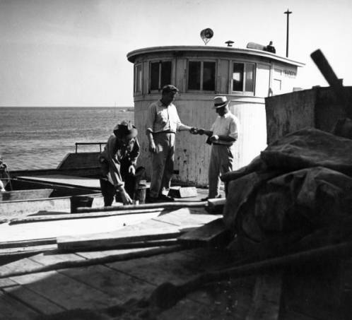 Paying Off Fisherman at Dock, Cape Hatteras 1945