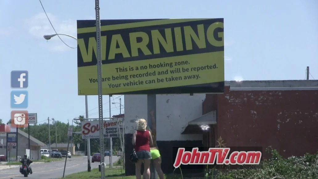 A local resident paid for this billboard. As you can see, it didn't have much effect. Prostitutes could often be found posing for pictures underneath it (as seen here).