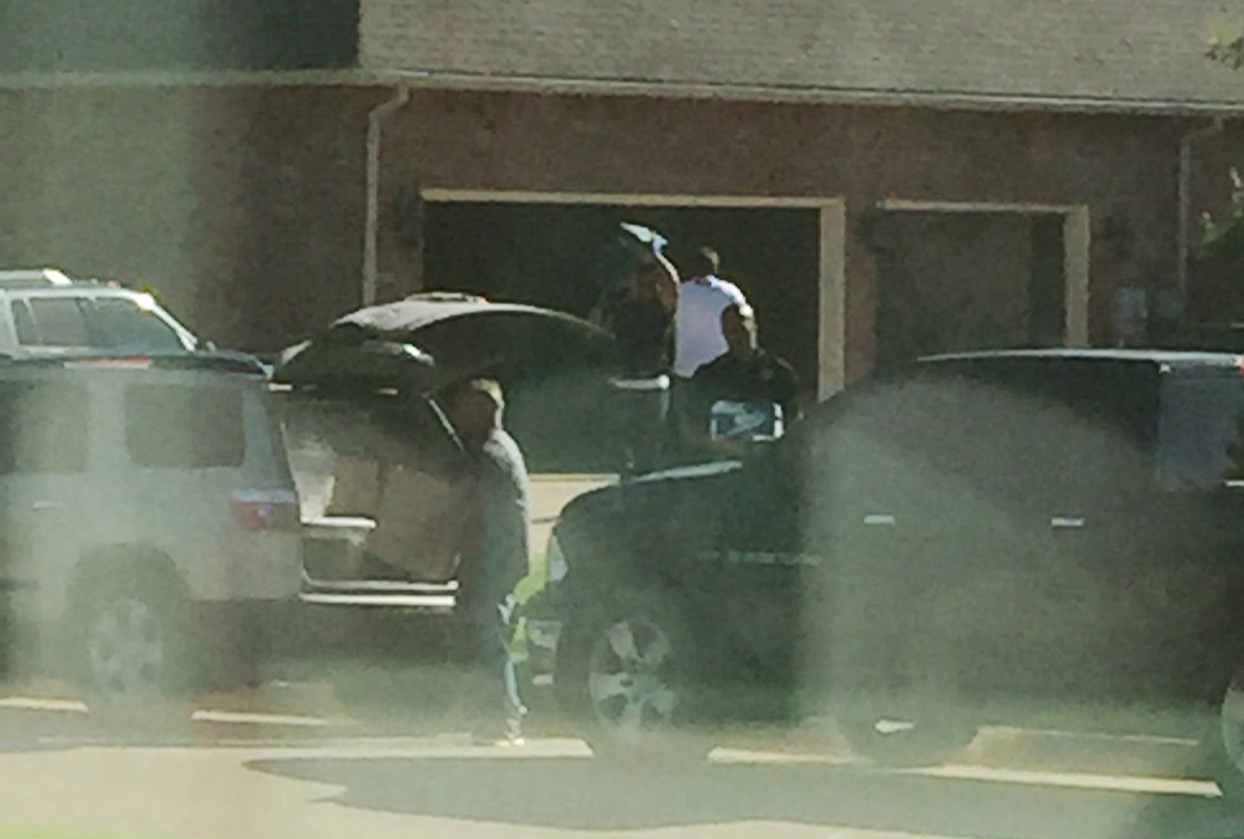 Federal officers removing potential evidence from the Gum residence.