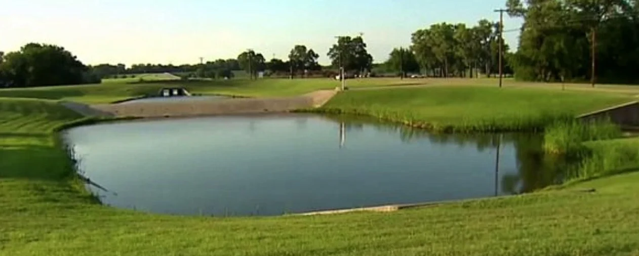 The pond at Blair Park in Dallas where Mitchell's dismembered body was found in 2017.