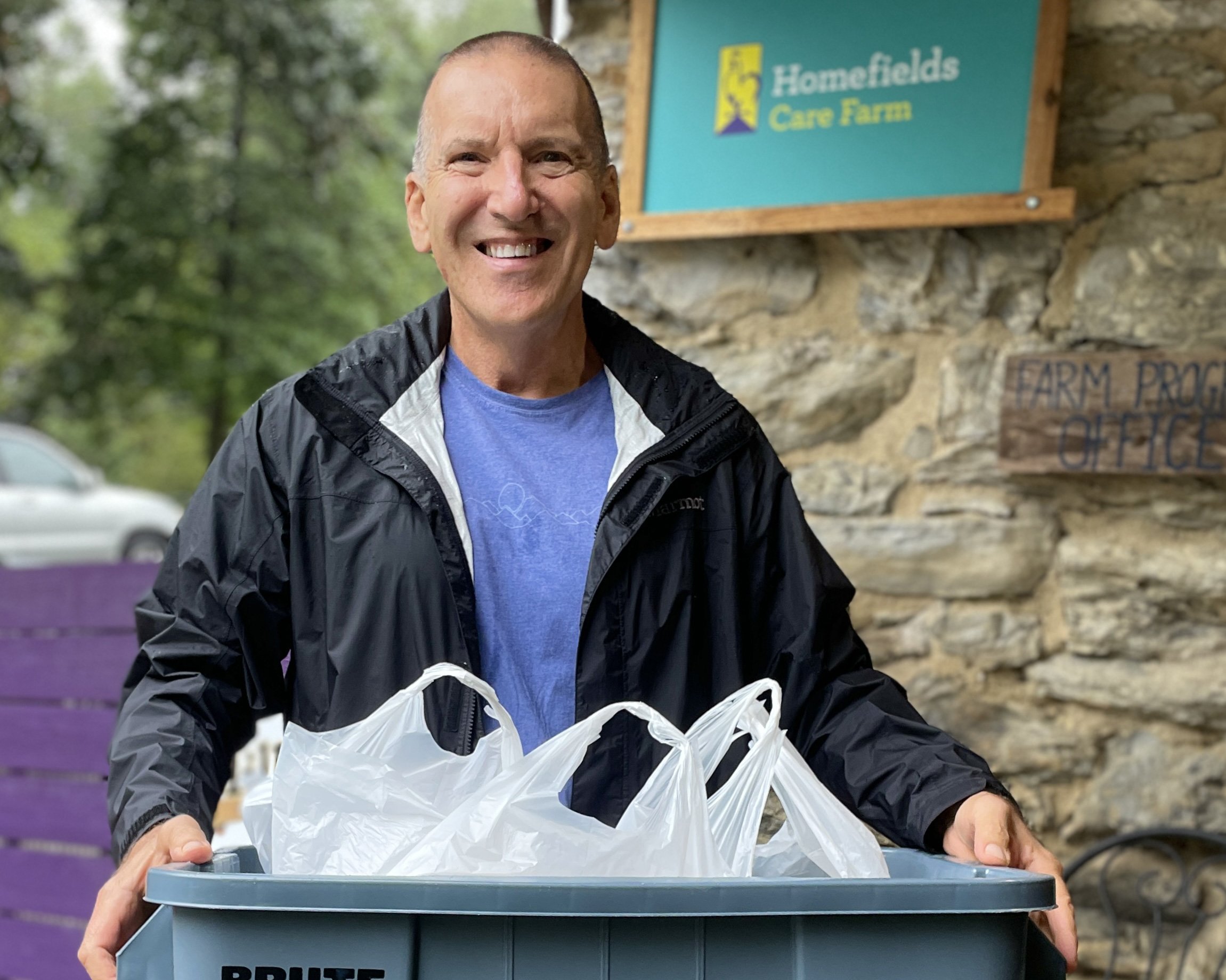  Bill Moshos, a long-time Homefields Care Farm CSA member, with our version of a picnic basket. 