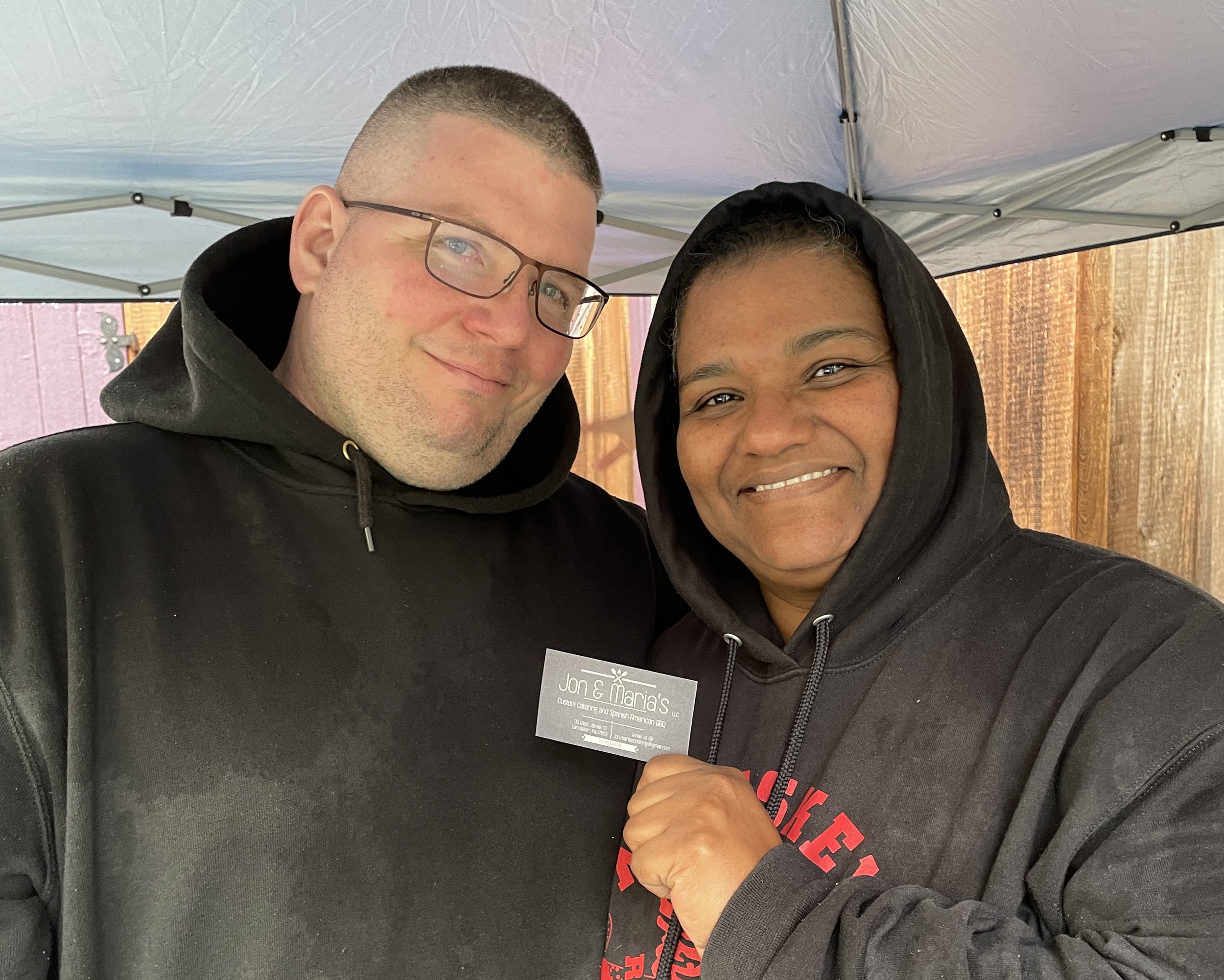  Chefs Jon and Maria from Jon and Maria LLC take a moment from preparing their  Taste of Homefields  small bites. 