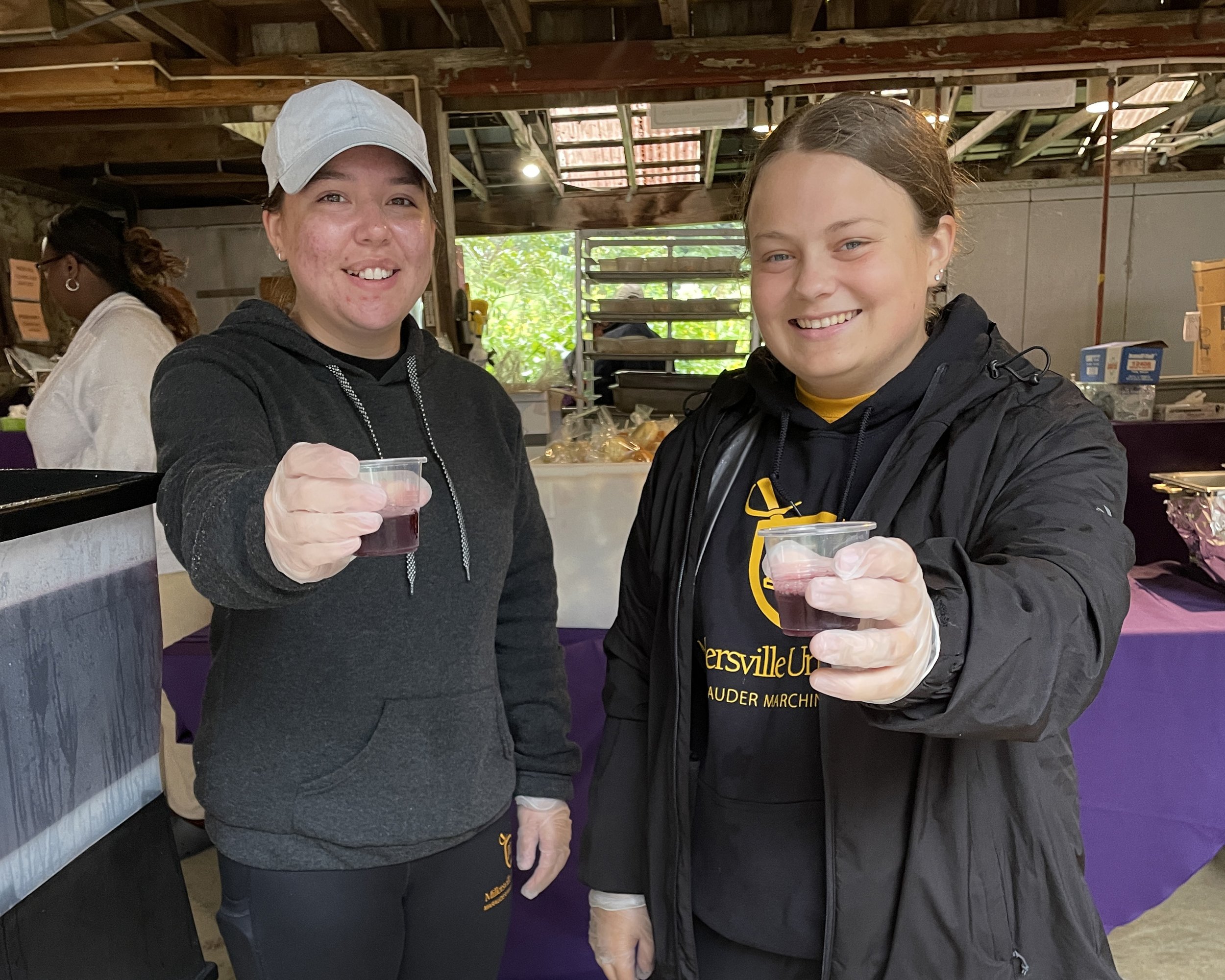  Volunteers from Millersville University’s Honors College provided support up and down the line, shown here serving hibiscus tea. 