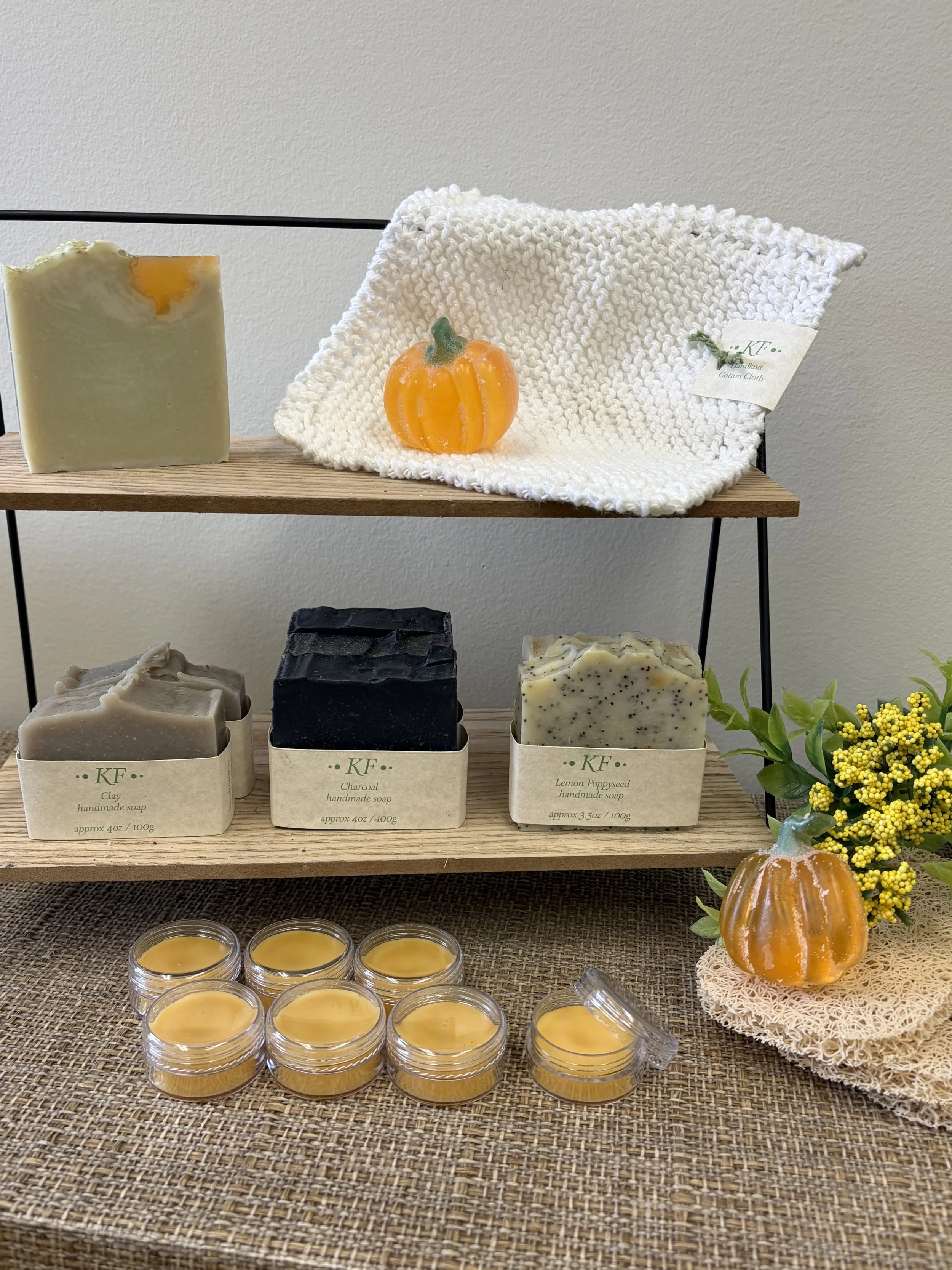  A tiered shelf displaying soaps and pumpkin-based balms. 