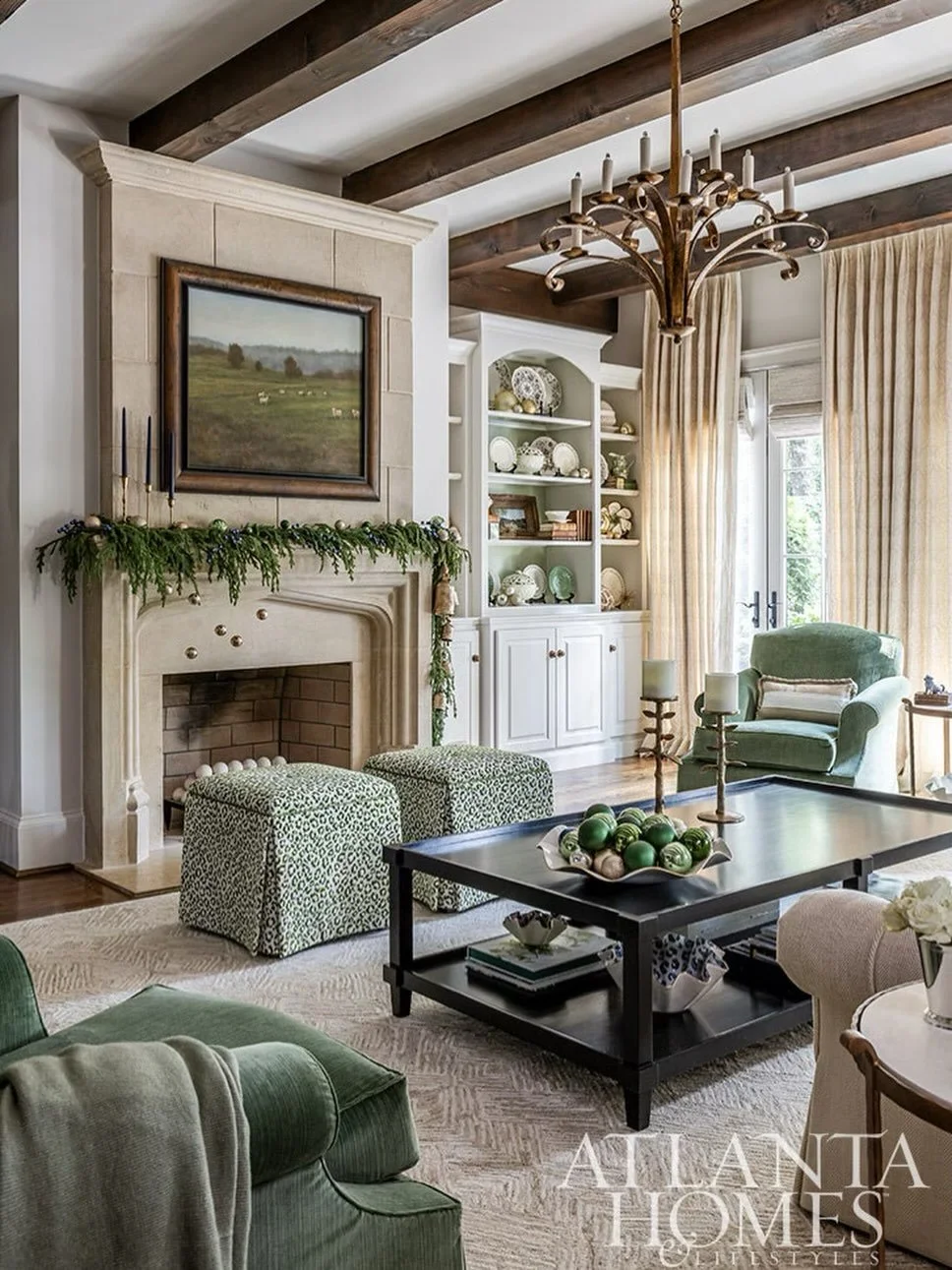 Seasonal greenery draped across limestone, warm light dancing off layered textures, and a palette that feels like winter calm-
This fireplace is ready for Santa&rsquo;s arrival Featured in Atlanta Homes &amp; Lifestyles December Issue 🌟 

 📖: @atla
