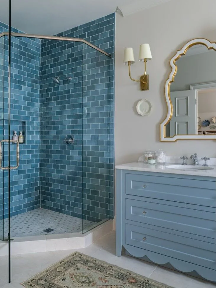 A guest bath glow-up that proves small spaces can still make a statement ✨
Soft blue cabinetry, timeless tile, and just the right touch of brass.

📸: @jeffherrphoto