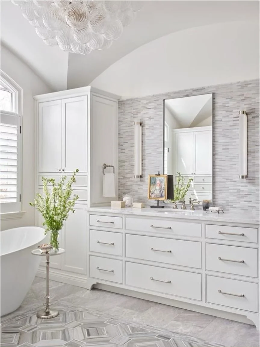 Custom vanity, layered tile, and tailored lighting brought together to create a calm, collected bath. Finished with a sculptural tub and subtle pattern underfoot&mdash;every detail working quietly, but intentionally.

📸: @emilyfollowillphotographer