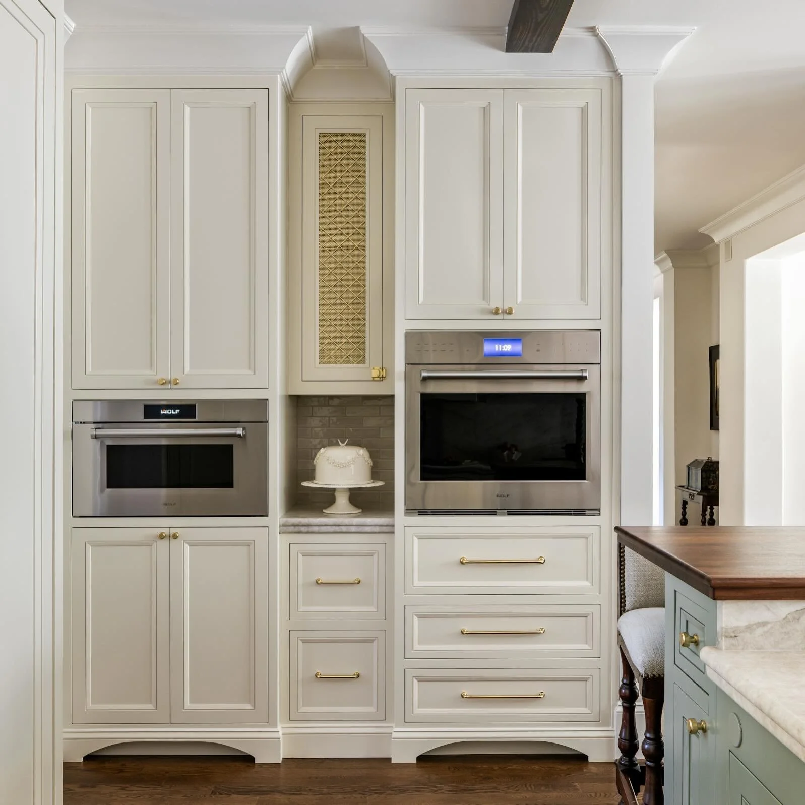 Proof that the hardest-working wall in the kitchen can still be the best dressed.

An appliance lineup that disappears into tailored millwork&mdash;layered with warm brass, a hint of texture, and just enough detail to feel special stealing the show. 