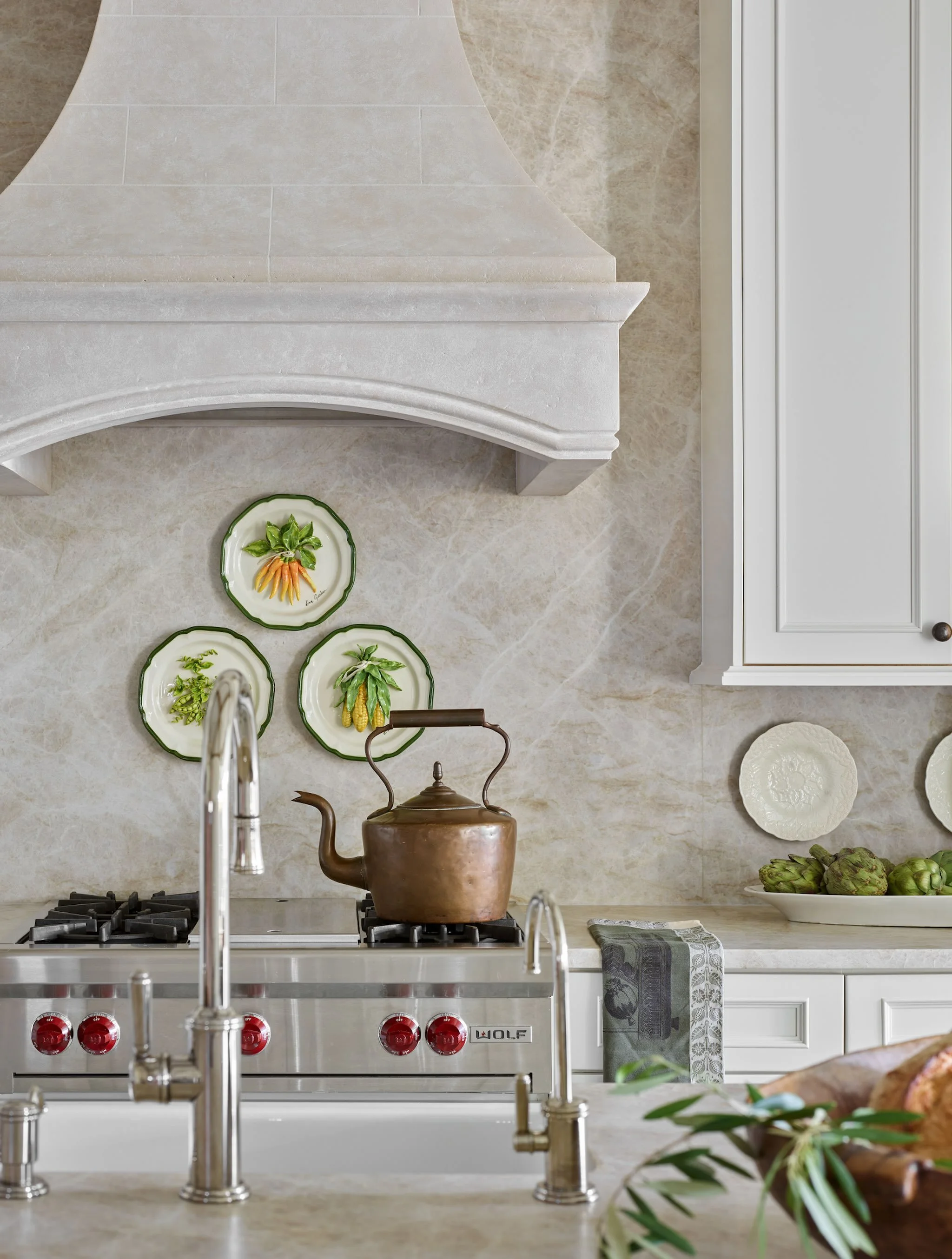 A softly layered palette, sculptural details, and a balance of warmth and refinement give this kitchen its timeless feel. We wanted every element &mdash; from the range wall to the subtle texture variation throughout &mdash; to feel intentional, invi