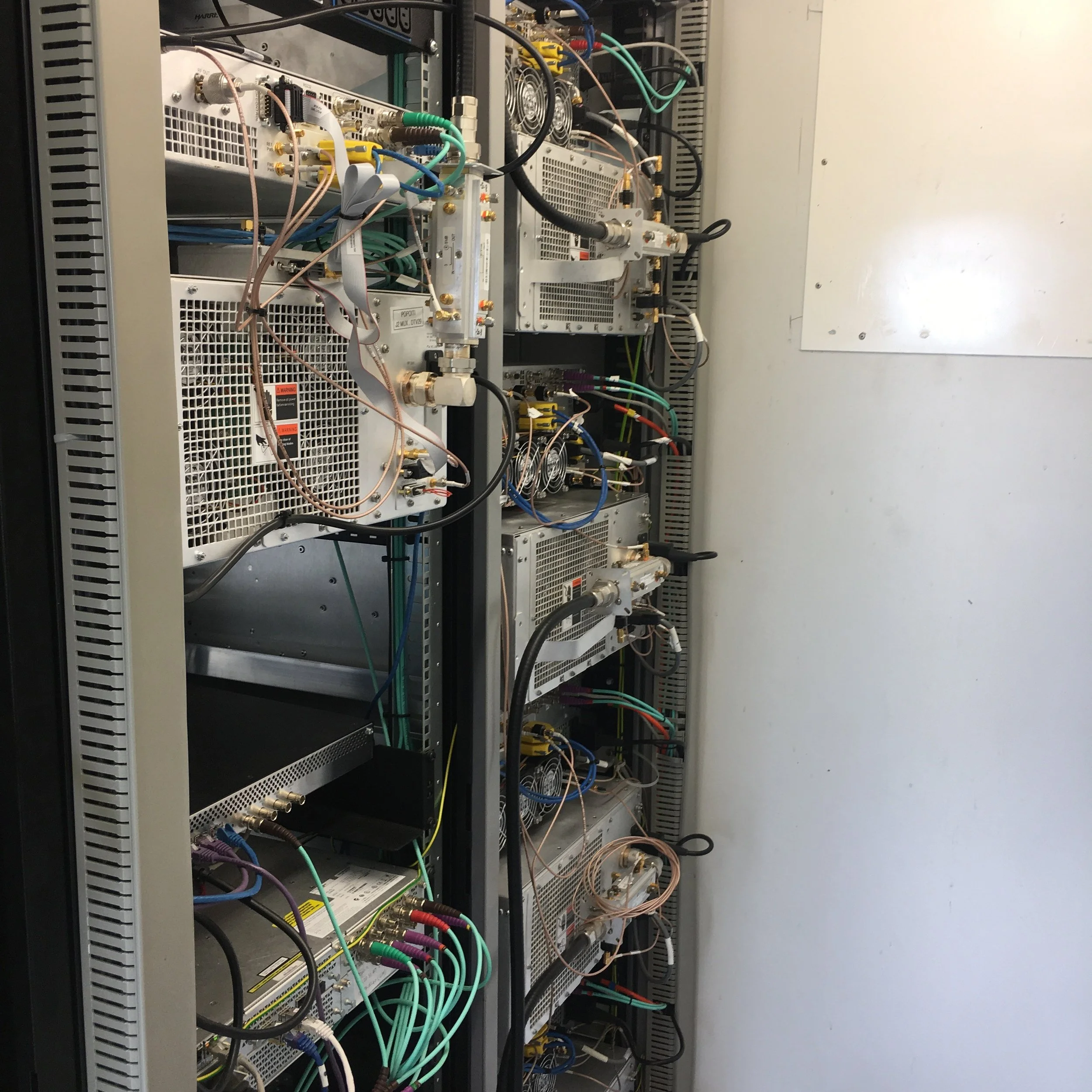 Each one of these units on the right is a MUX amplifier which amplifies 6 to 8 TV channels each. The signal from TVNZ is coming in on the green cables at the bottom and ours is in there somewhere.