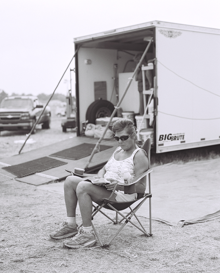 Lenora takes a break outside the laundry truck.