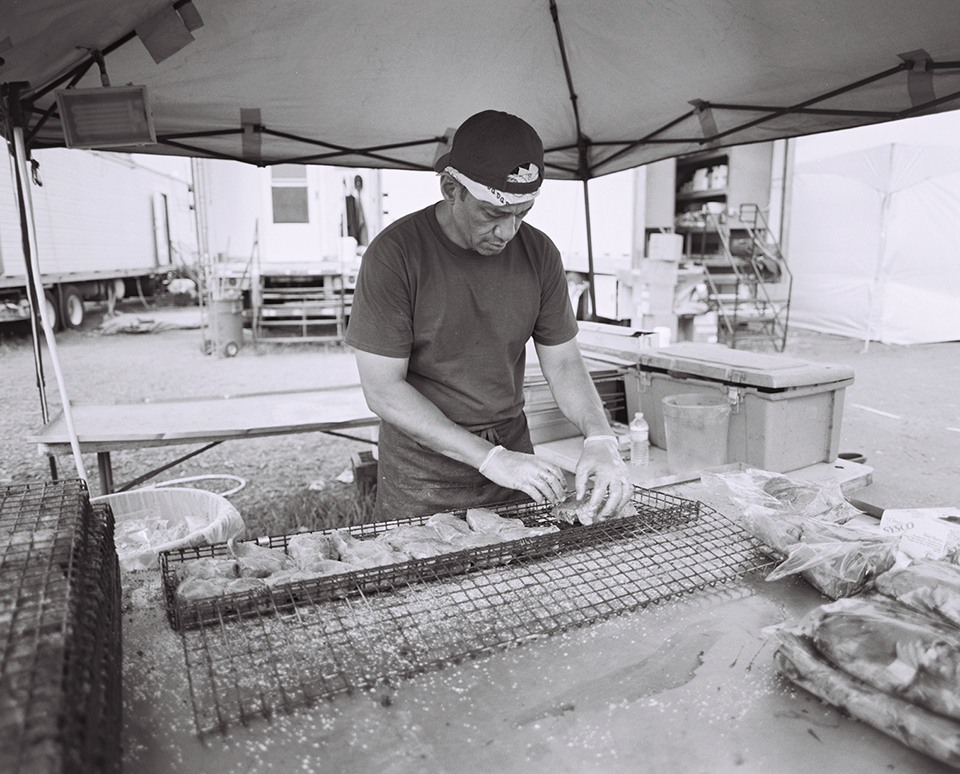 Tom prepares dozens of steaks for the grill. Besides steak, tonight’s meal will include roasted potatoes, peas & onions, vegetable goulash, and a salad & dessert bar. Fire crew members are fed 6000 calories a day to sustain their strenuous activity.