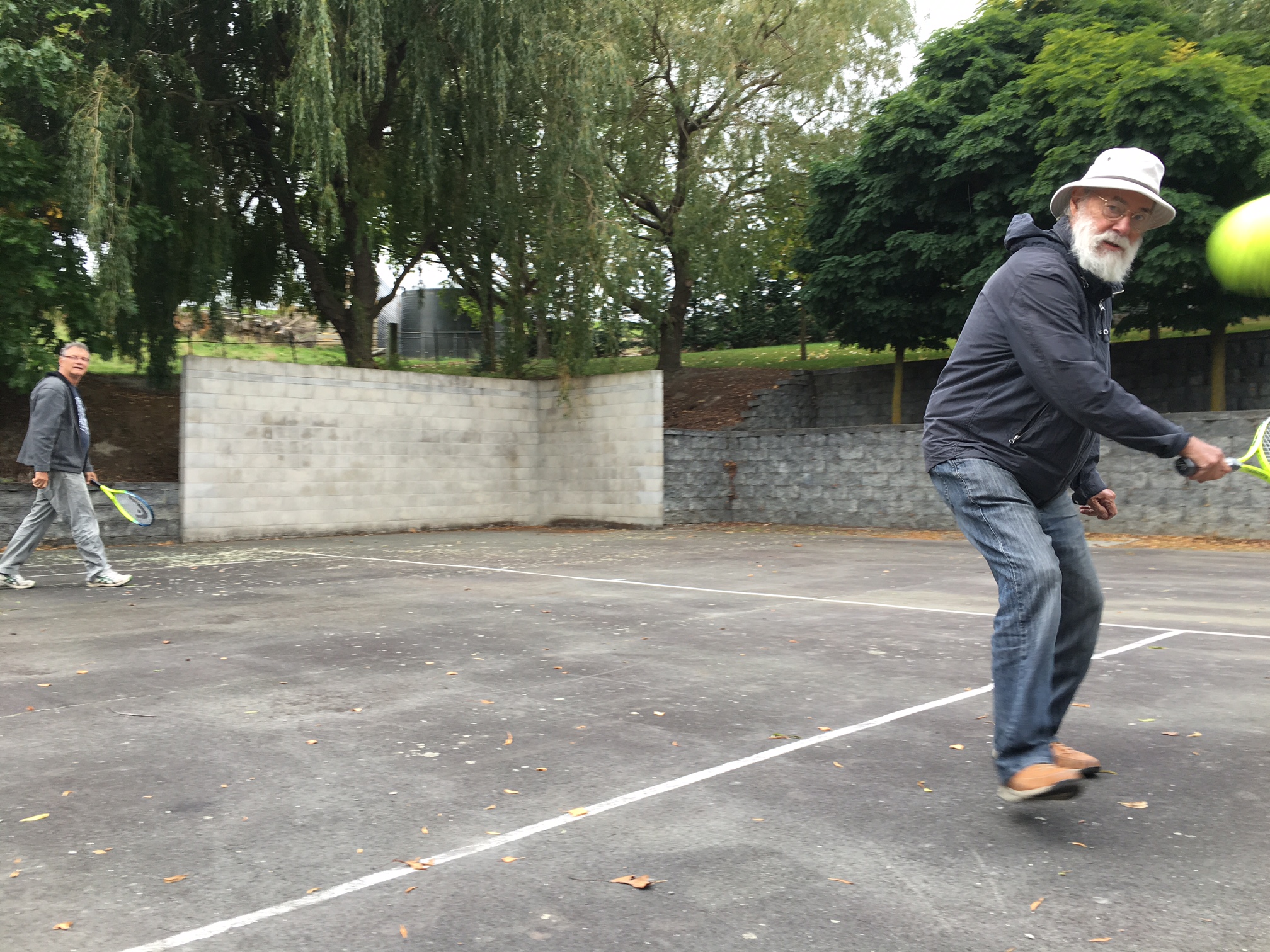Ron Mcburnie and Kevin Connor on the tennis court at Giverny