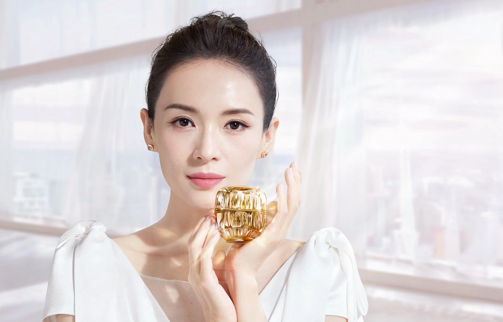Clé de Peau Beauté La Crème held by Zhang Ziyi — campaign key visual, product photography by Hiro