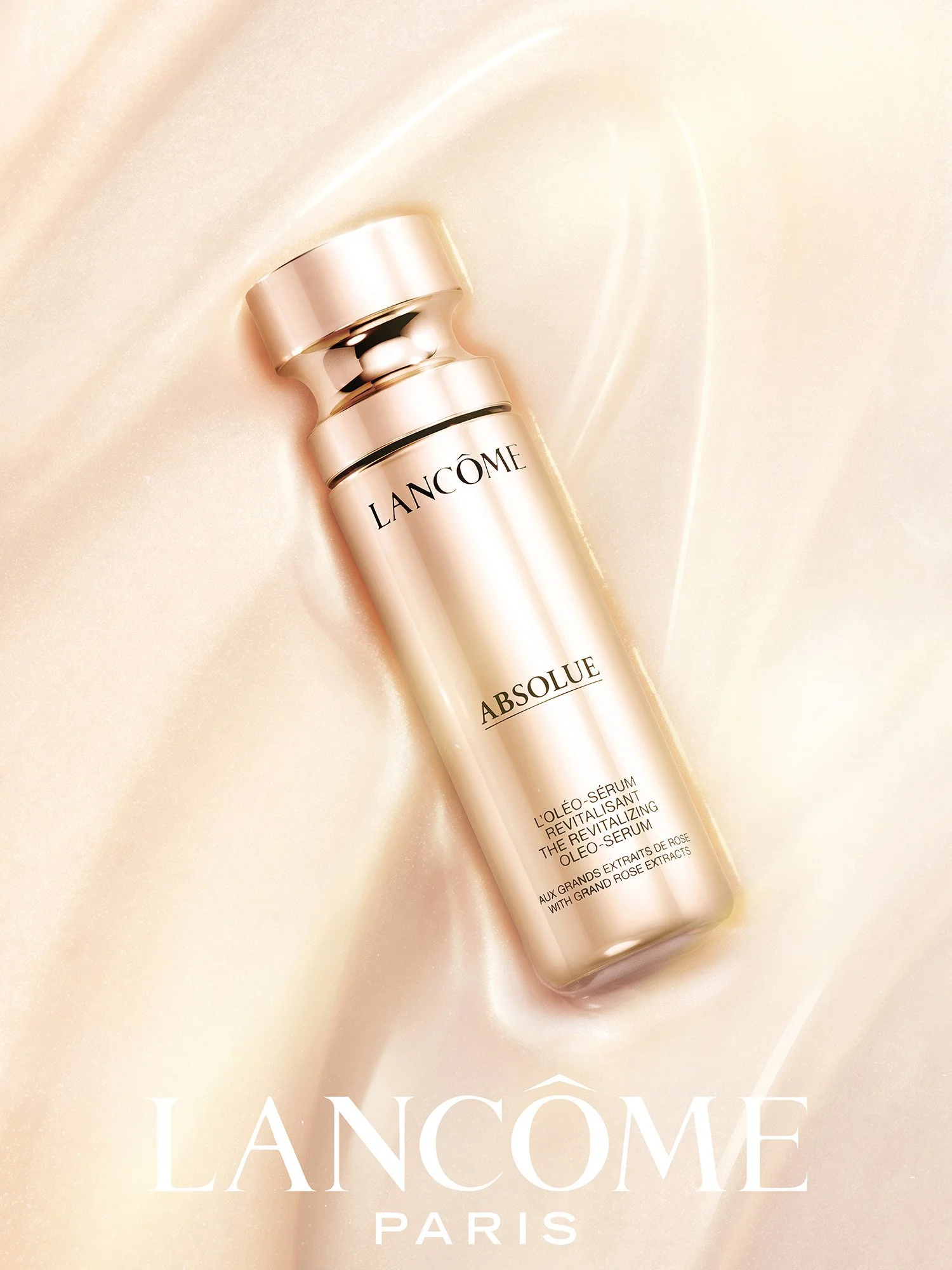 Lancôme Absolue Revitalizing Oleo-Serum in rose gold, lying in its own shimmering texture, key visual by Hiro