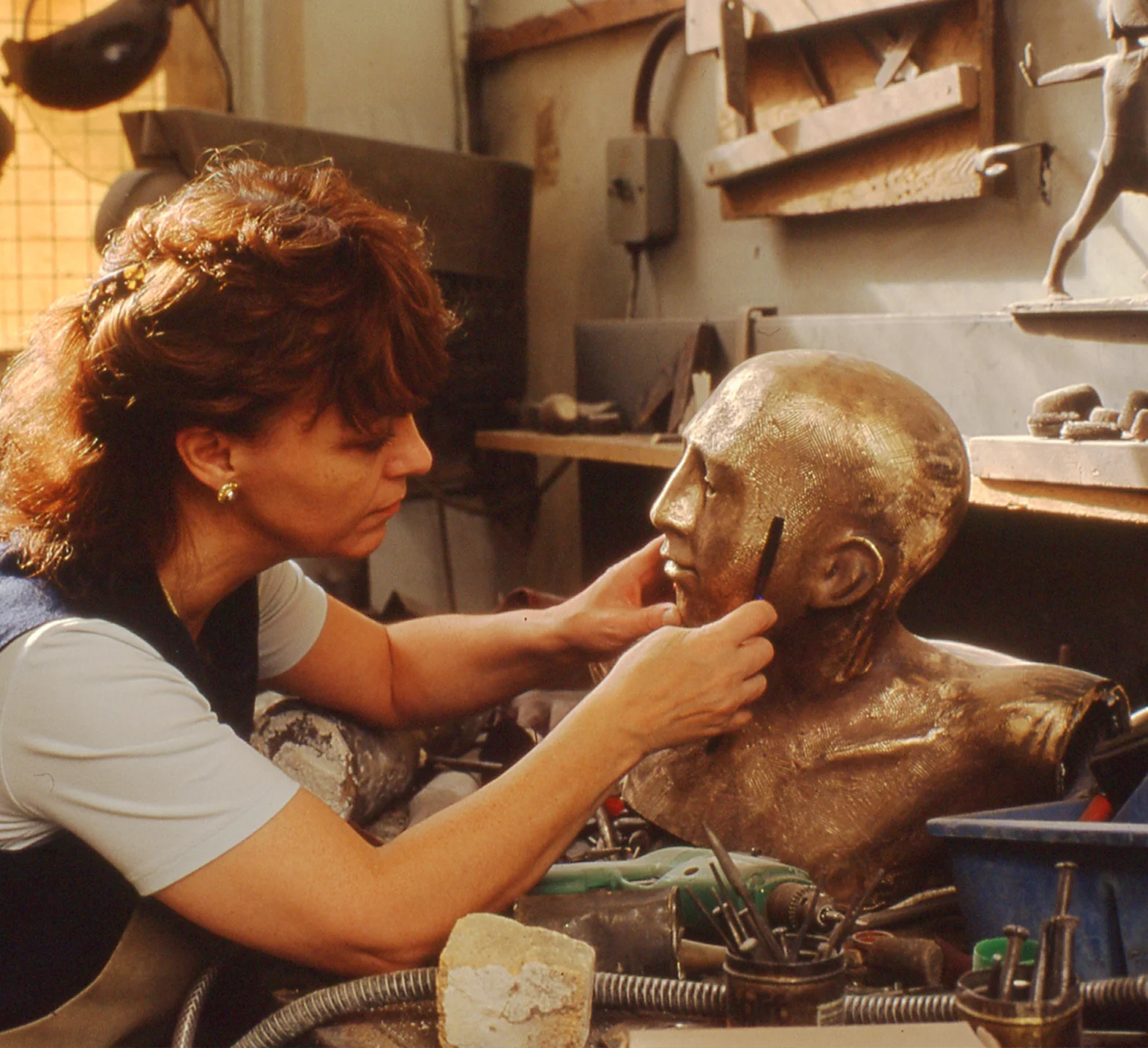 Philomena working on a sculpture in bronze titled "Fairway" commissioned by Sir Peter Michael CBE for Donnington Valley Hotel & Golf Course, Newbury, UK.