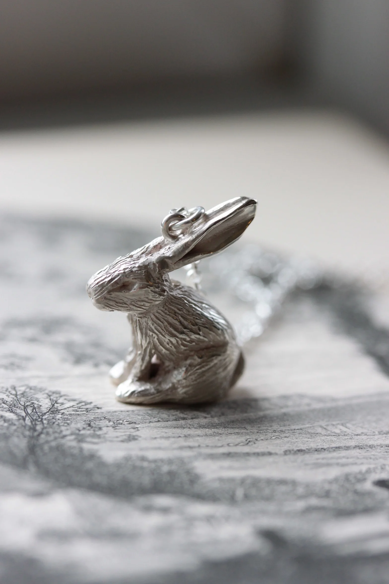 Our tiny rabbit necklace in sterling silver.