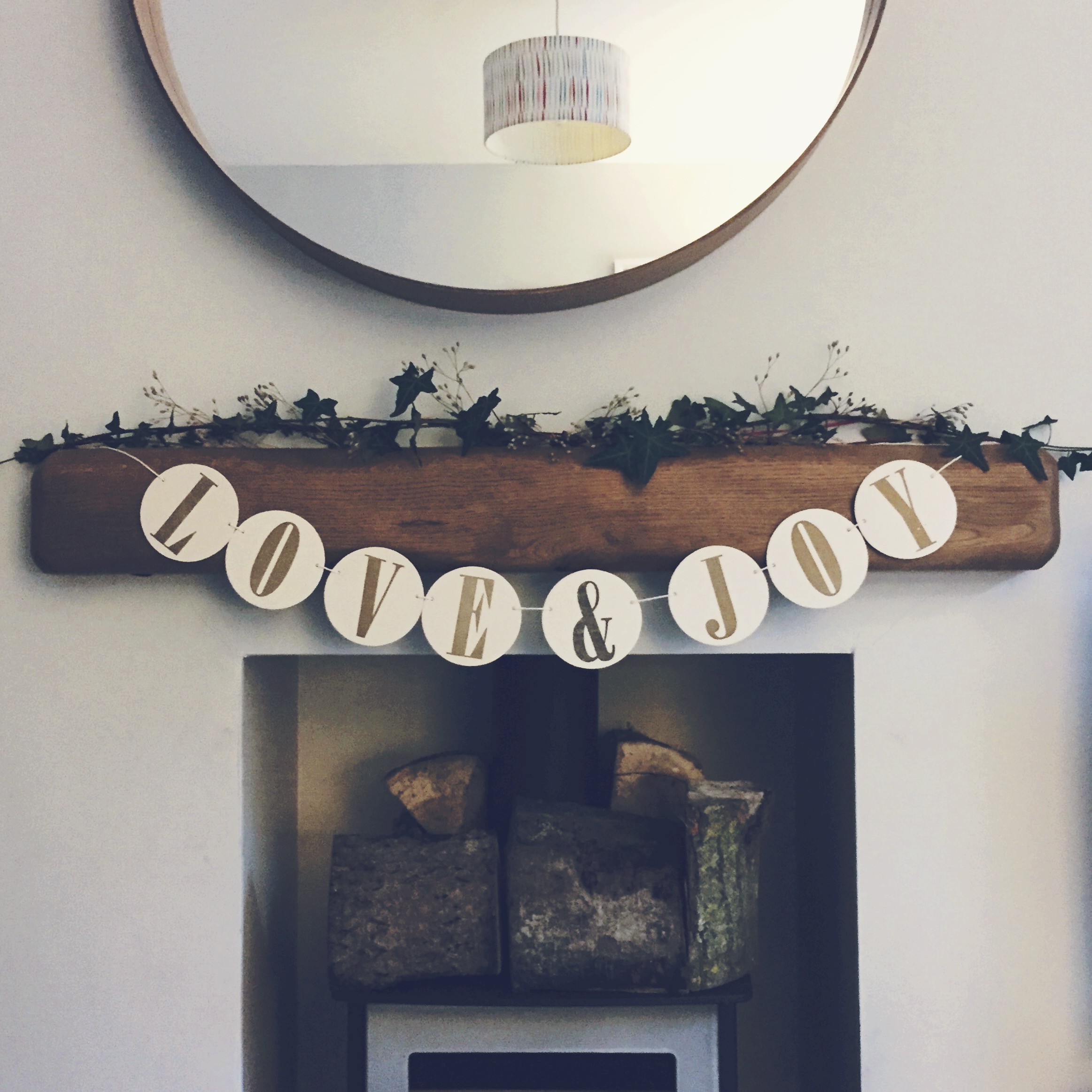Ivy and dried wildflowers collected from the woods made a festive garland for our fireplace.