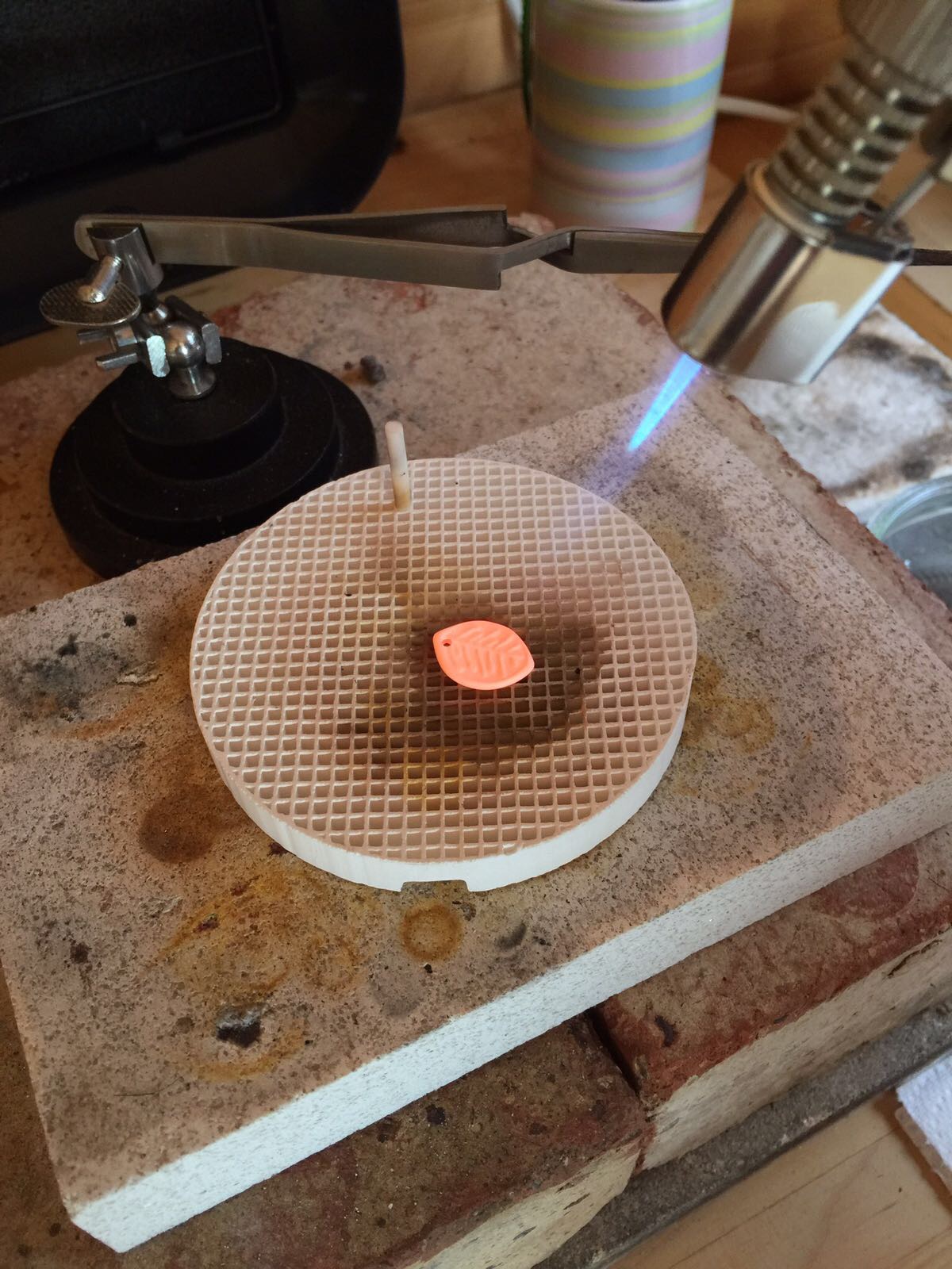 Firing the precious metal clay. Care needs to be taken with timings and temperatures.