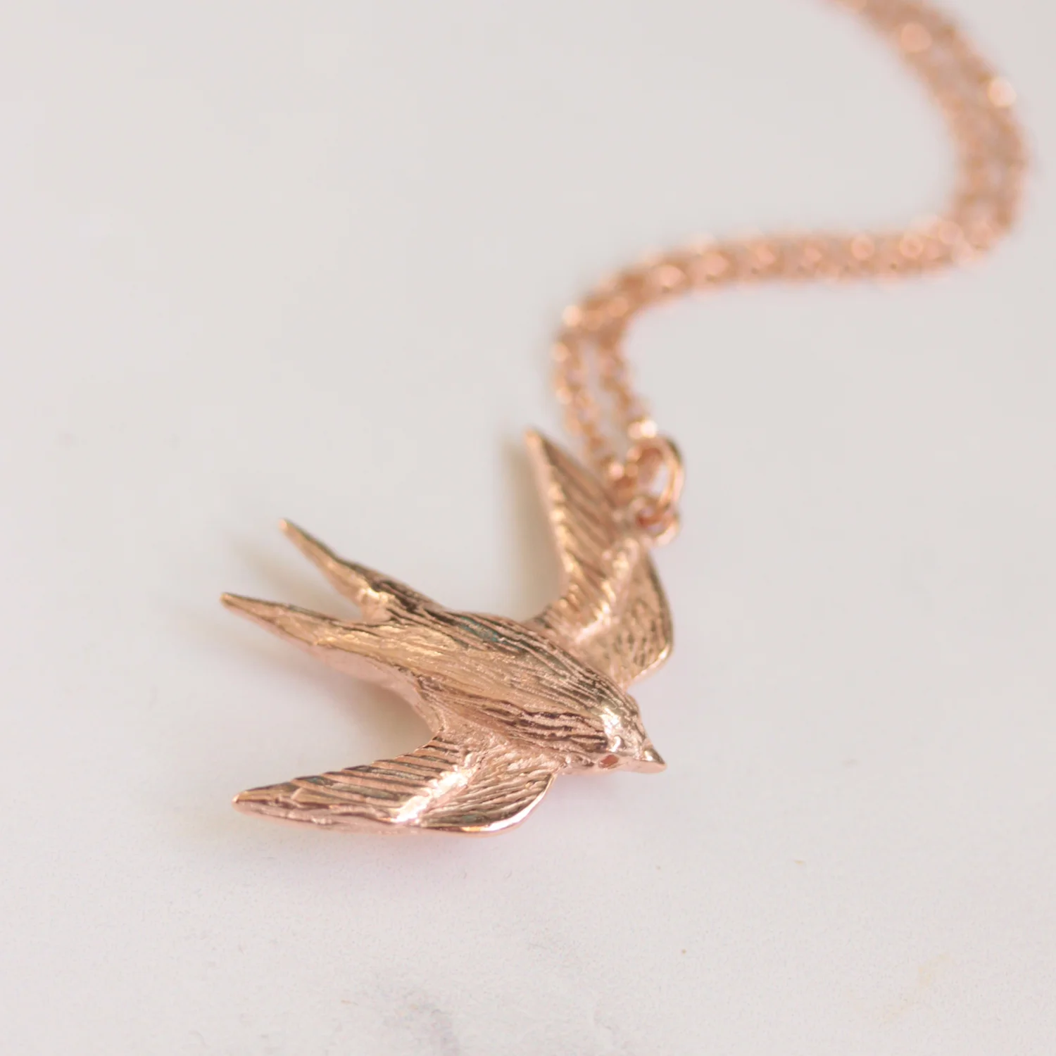 rosegold_swallow_necklace_1.jpg