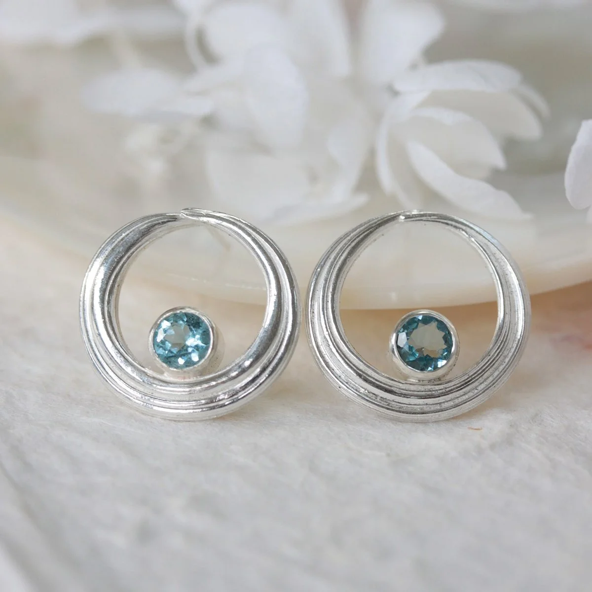 Textured silver circle studs with aquamarines