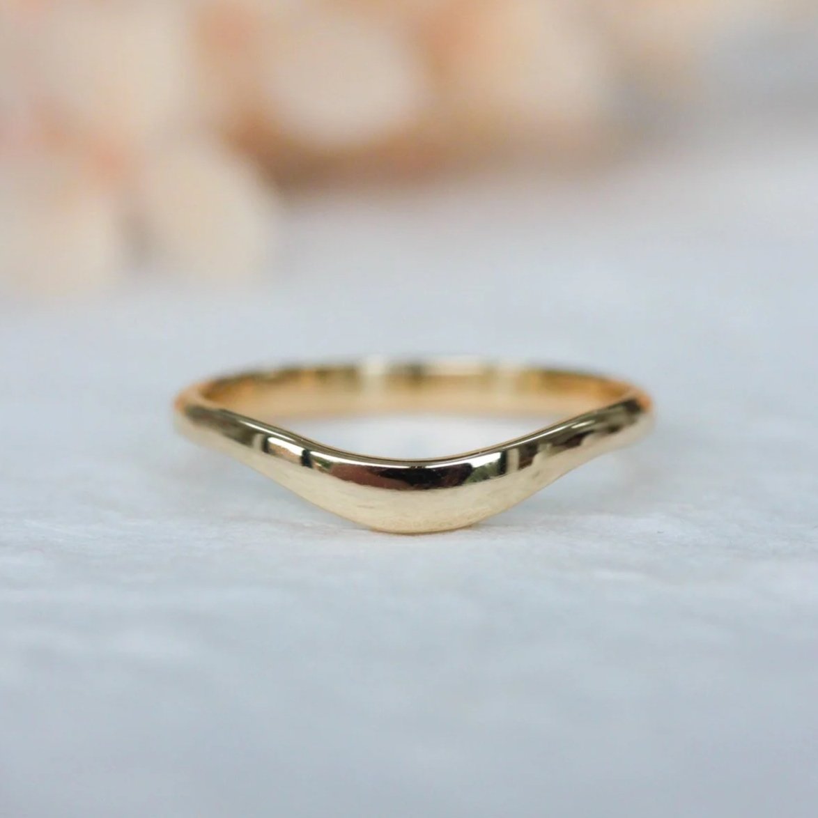 Gold curved wedding ring