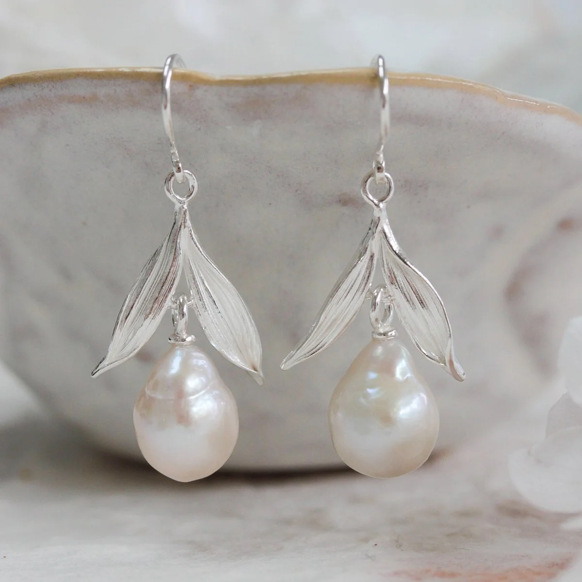 silver pearl drop earrings with leaf detail