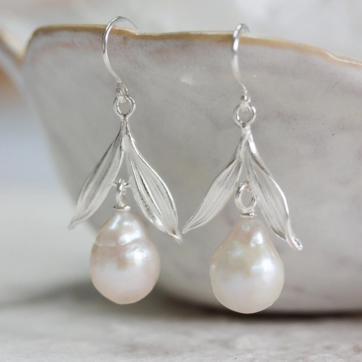 delicate silver baroque pearl earrings