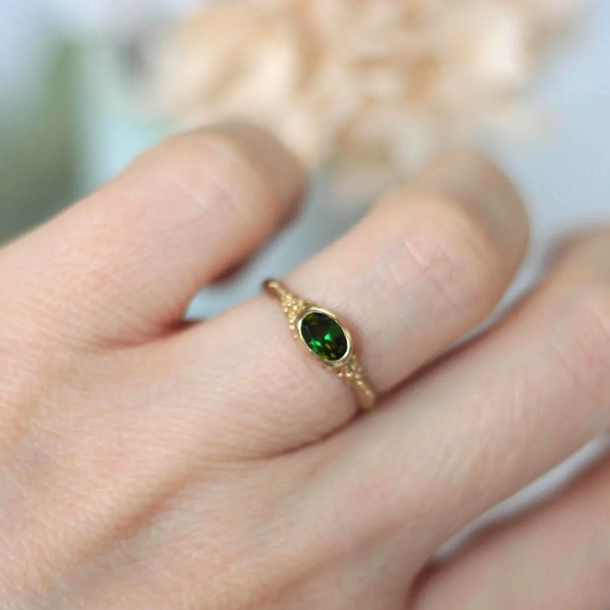green_tourmaline_gold_ring_on_model copy.jpg
