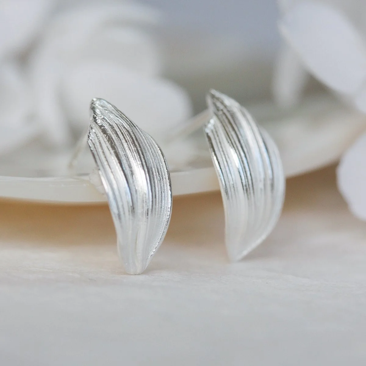 delicate silver leaf studs