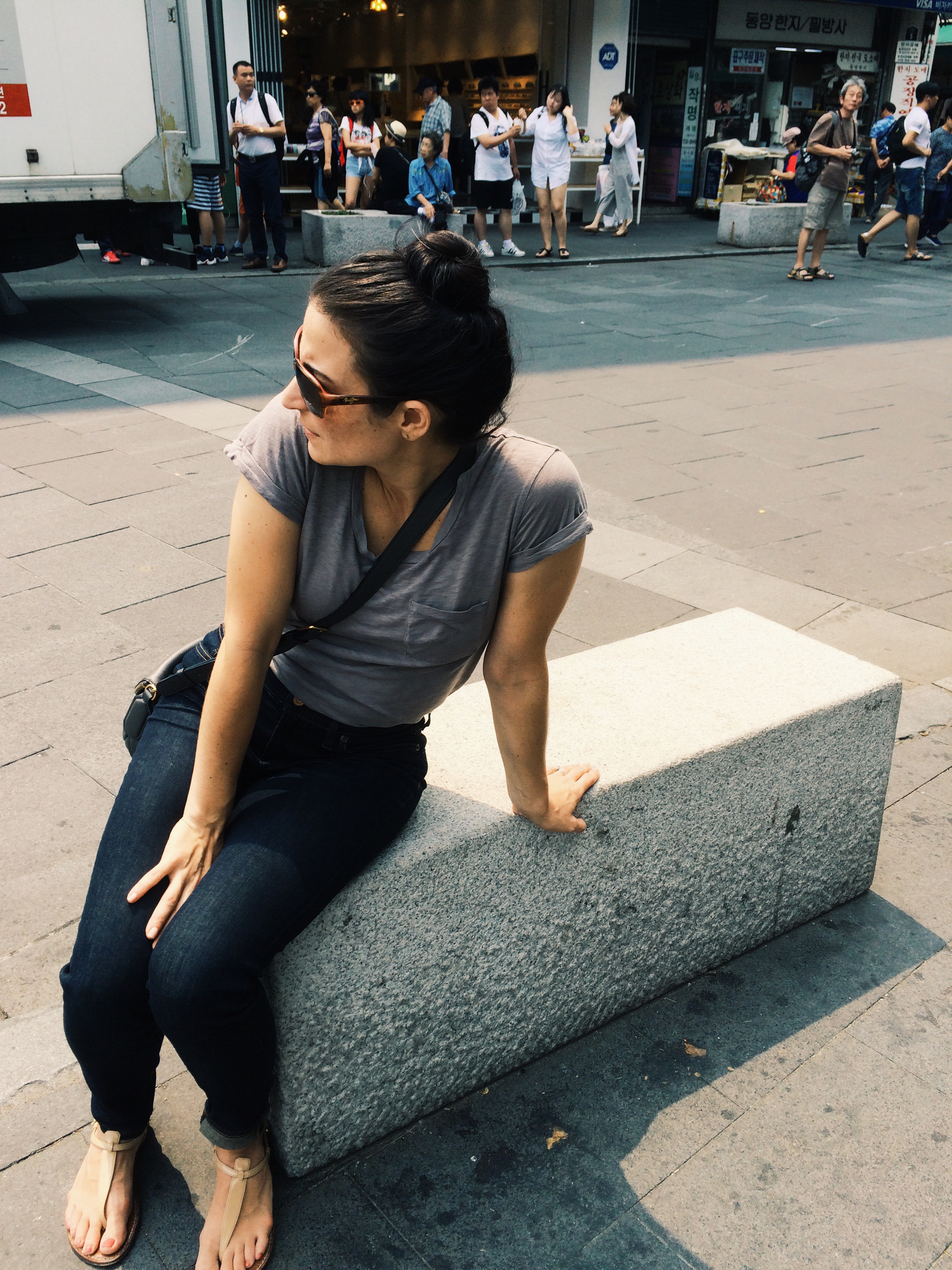 Sitting on a bench, deciding what to do next. Tough life, right?