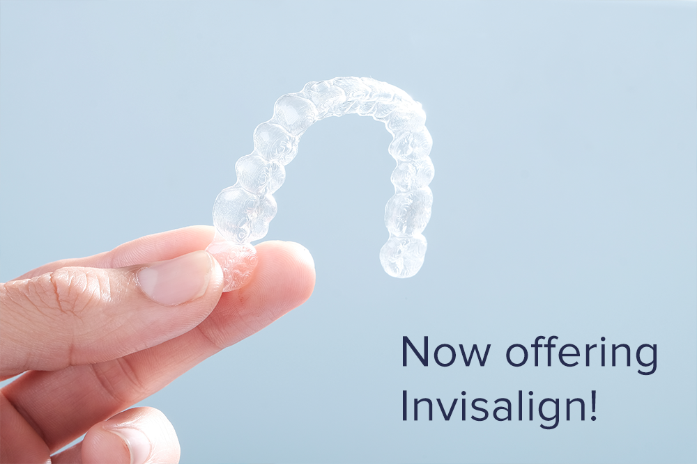 Person holding an Invisalign retainer