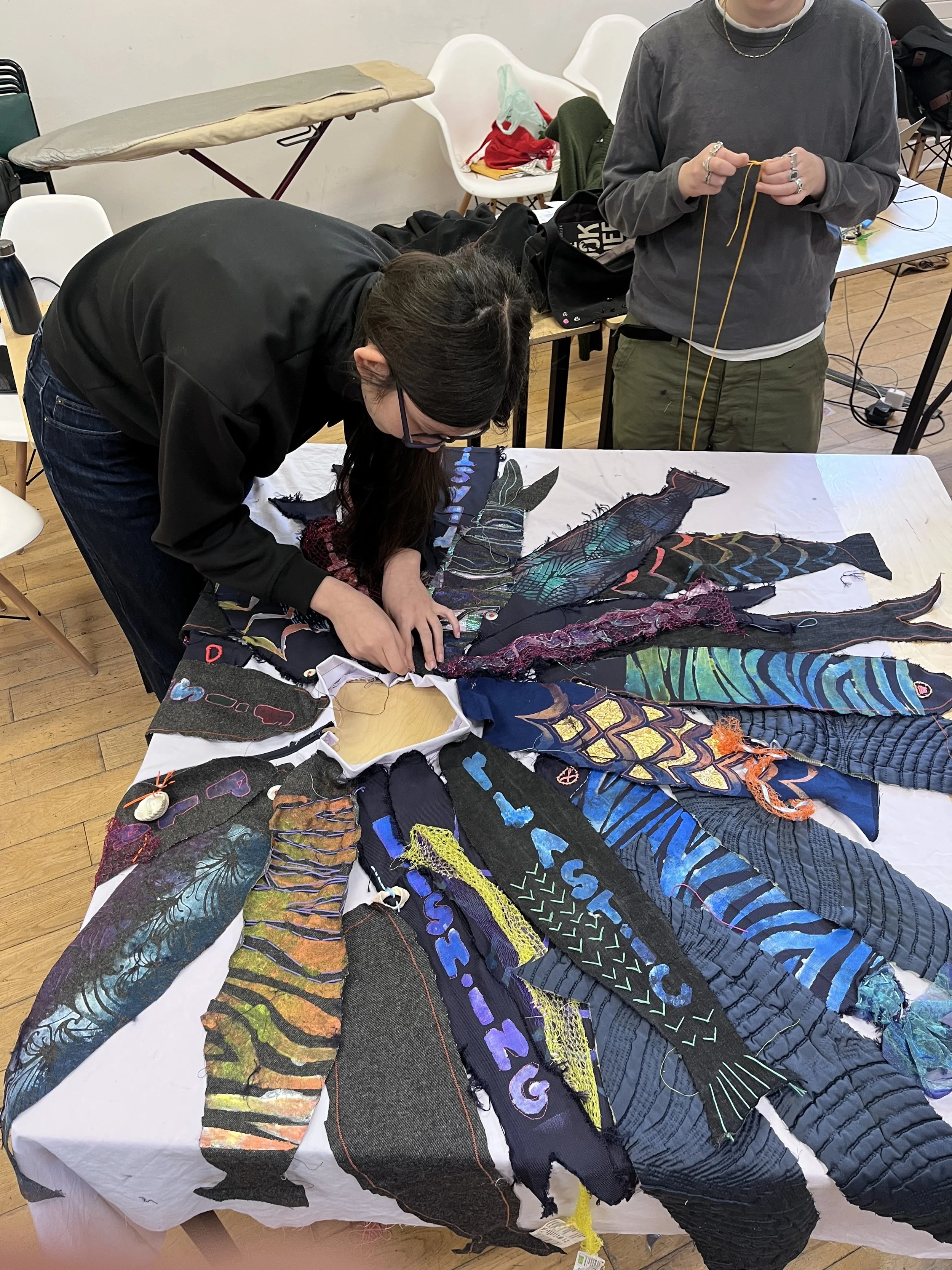 Student working on fish skirt.jpg