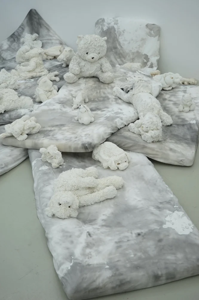 The Raft of the Teddy Bears , 2017, detail of the Installation (porcelain sculptures, mattresses, Chinese ink), variable dimension