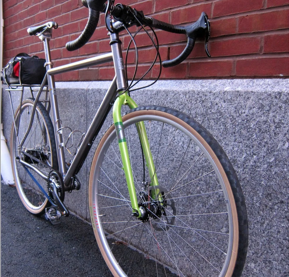 This Seven ExPat has a custom steel fork, Rohloff hub with belt drive and a lightweight rear rack. After this photo was taken, the bike received a generator light and hub to make it even more long-distance worthy. Note that a PBP-specific bike will have different design and component choices made. Bikes great for touring or for shorter randonneuring rides will look a little different than the ideal PBP bike. This bike, for example, shows off a lot of great features and functionality options, but wasn’t designed for PBP.