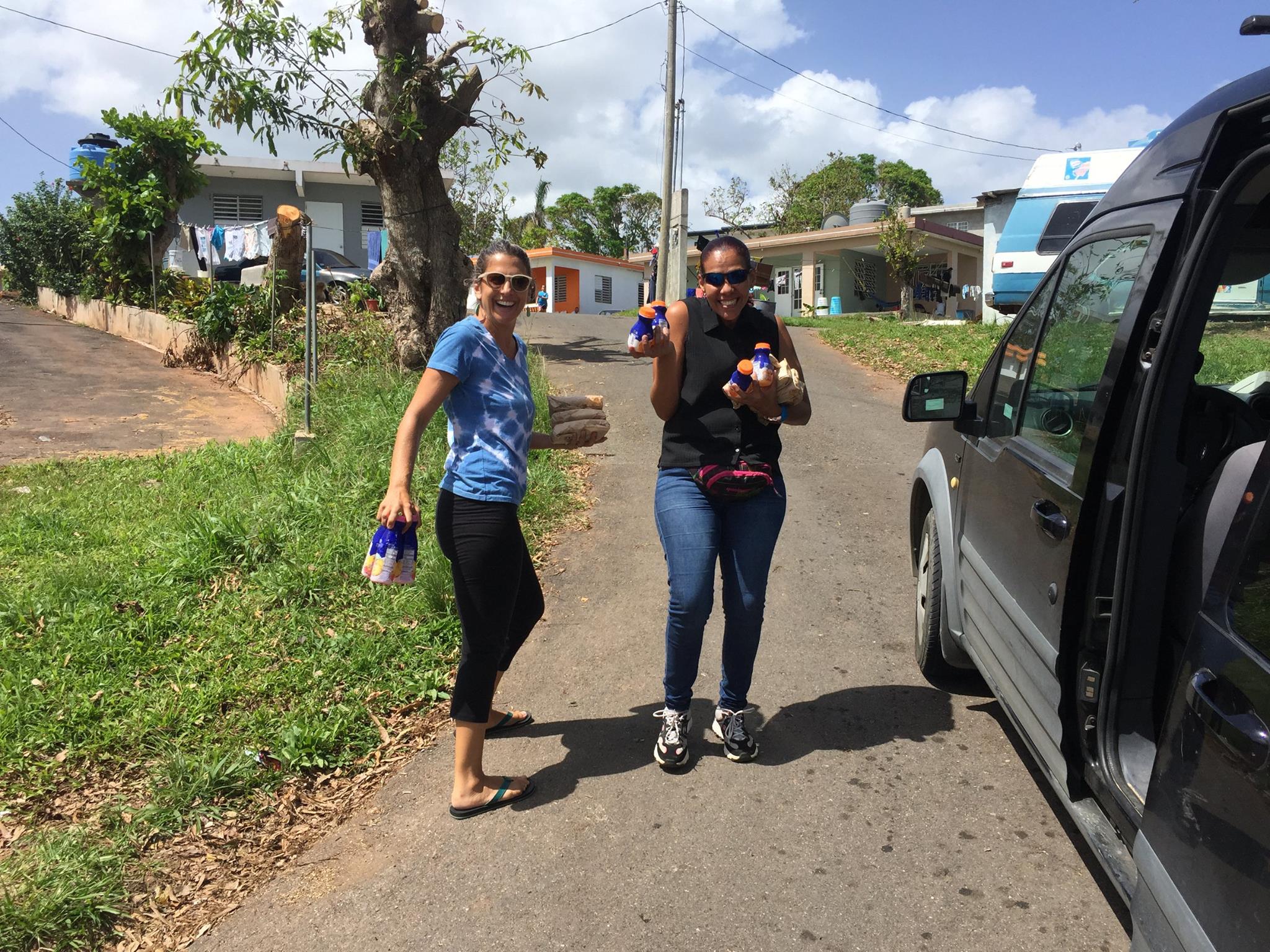 Vivienne Miranda + friend bringing food and drinks to neighborhoods in Anasco that have received no aid.