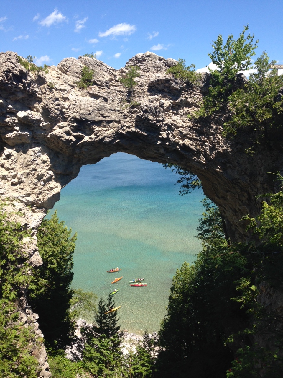 Arch rock with a view of the amazing colors of both lake and sky