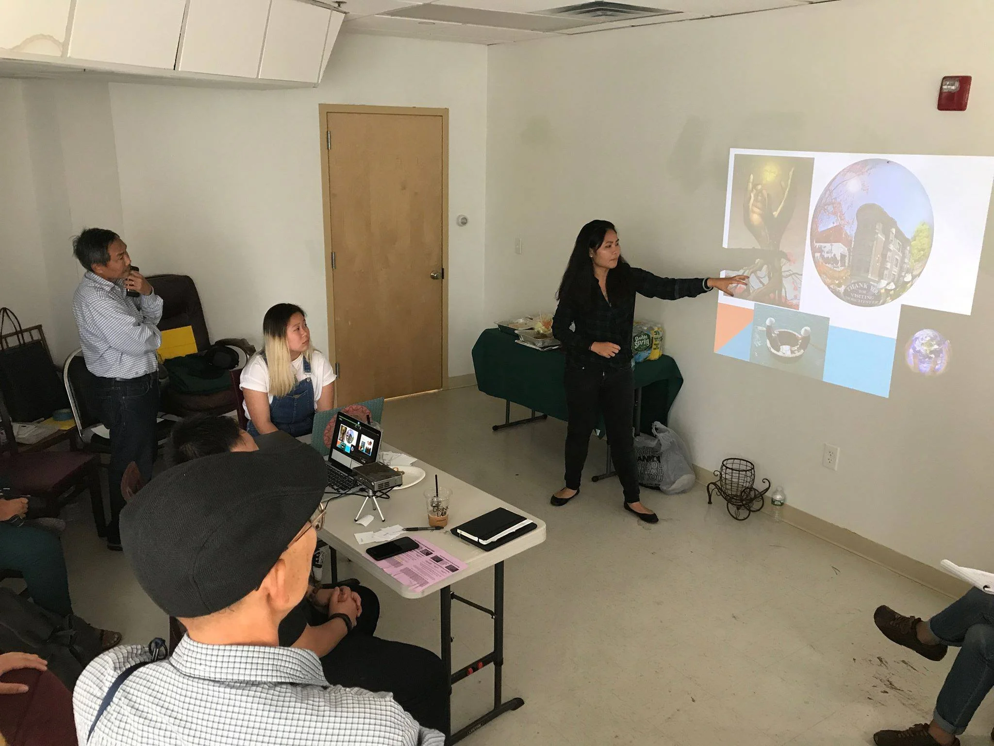 Left to right: Hung, Cuong, Kathy, Tran Tran was presenting and dissecting ideas that were put into the mural. (Photo: Son Ca)