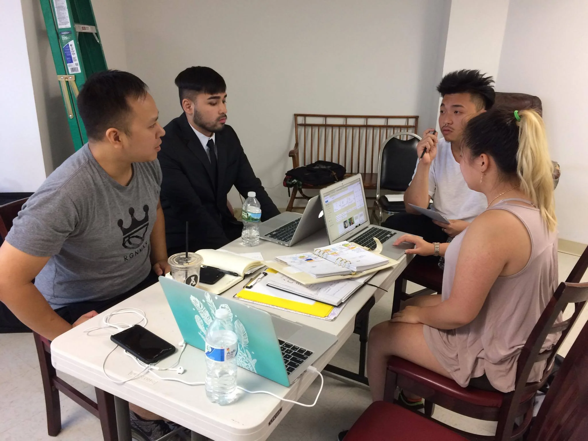 Left to Right: Tam, Tony, Justin, Kathy Putting all thoughts and minds together for the art pieces. (Photo: Tran)