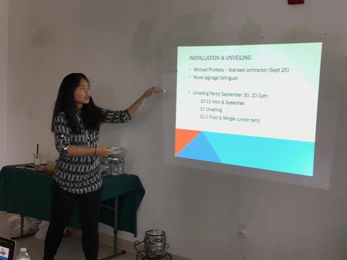 Tran talks logistics of future events that will be happening! (Psst~ Read the projection!) Photo credit: Son Ca