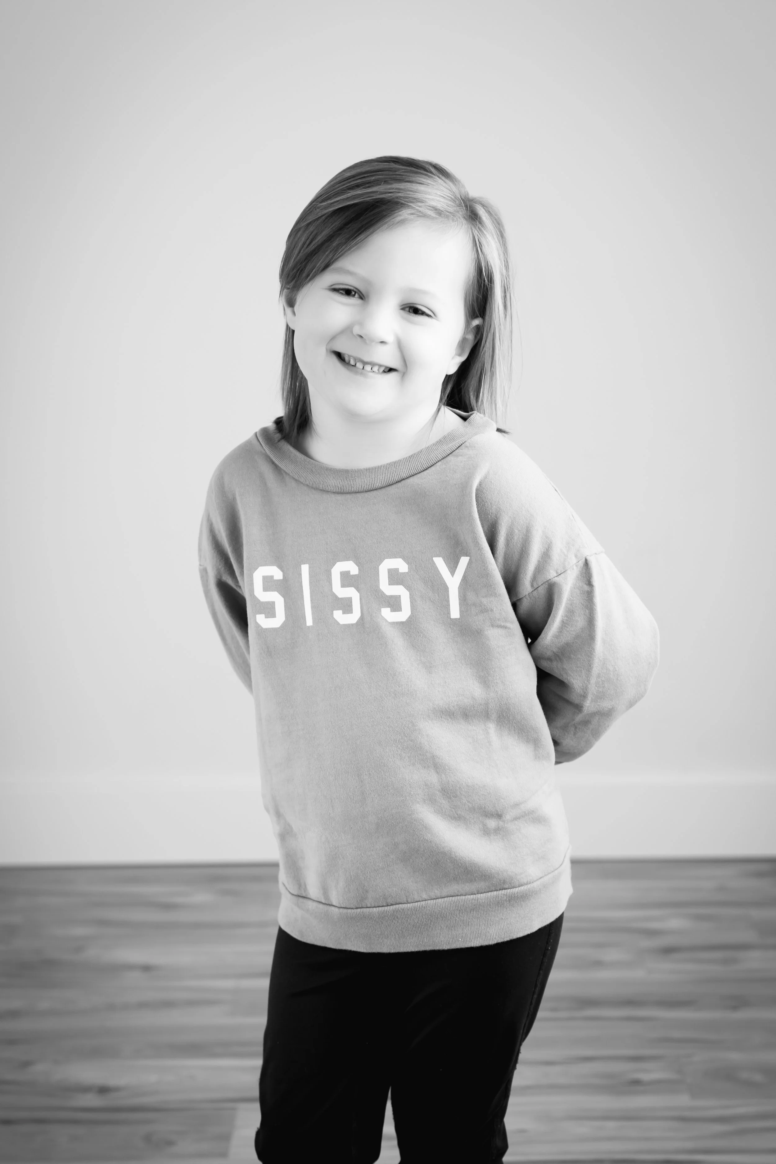 Young girl smiling in black and white