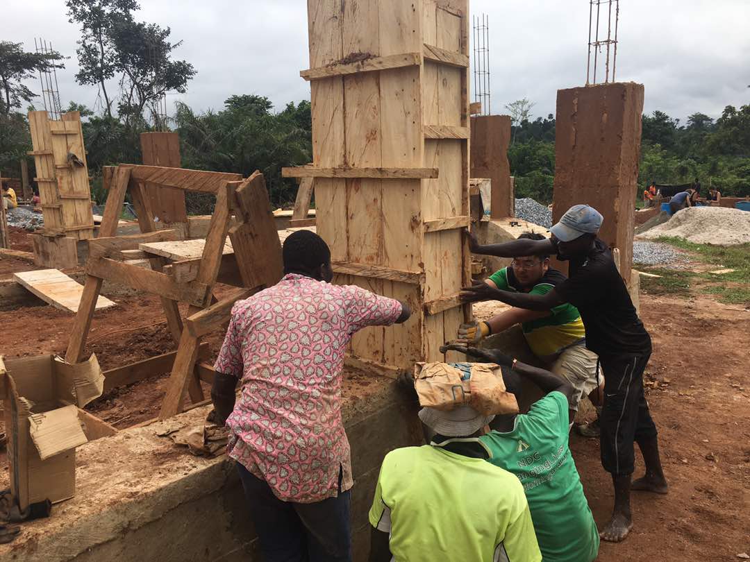 village men helping the team