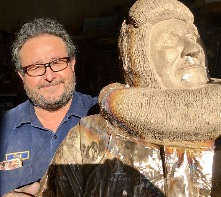  Pat poses with Joe Reddington, his latest bronze work, to be installed in 2017 at the Joe Reddington Junior Senior High School in Wasilla. 