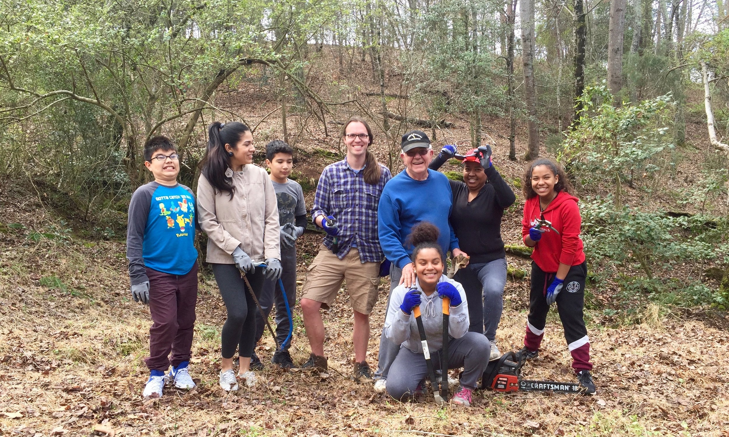 Some local volunteers gather to help improve the property on a Saturday afternoon.
