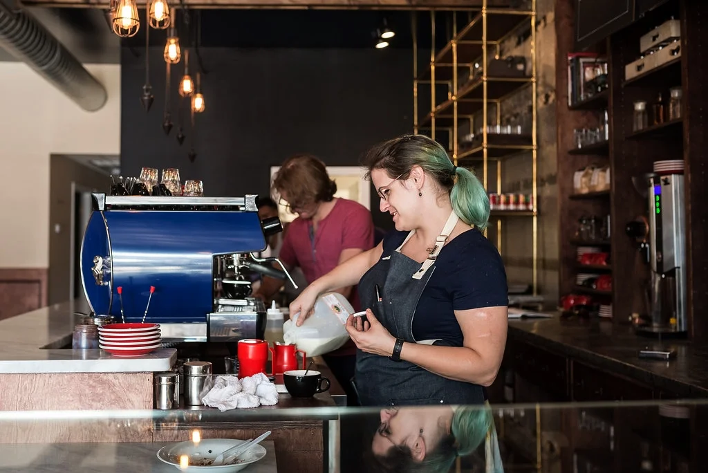 INSERT PICTURE OF GROUP AROUND TABLE ENJOYING FOOD/DRINK
